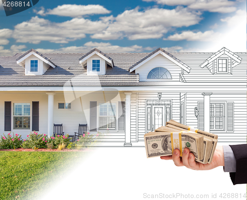 Image of Hand Holding Stack of Money Over House Drawing Gradating Into Ph