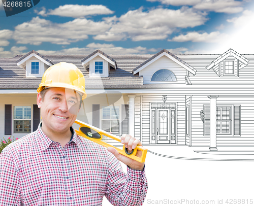 Image of Male Contractor Wearing Hard Hat In Front of House Drawing Grada