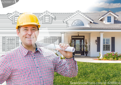 Image of Male Contractor Wearing Hard Hat In Front of House Drawing Grada