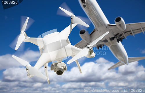 Image of Unmanned Aircraft System (UAV) Quadcopter Drone In The Air Too C