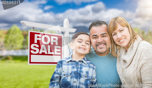Image of Mixed Race Family Portrait In Front of House and For Sale Real E