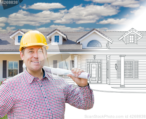 Image of Male Contractor Wearing Hard Hat In Front of House Drawing Grada