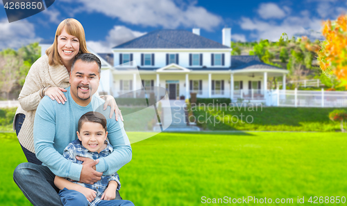 Image of Mixed Race Family In Front Yard of Beautiful House and Property.