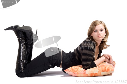 Image of the sexy young woman laying on a pillow. Isolated 1
