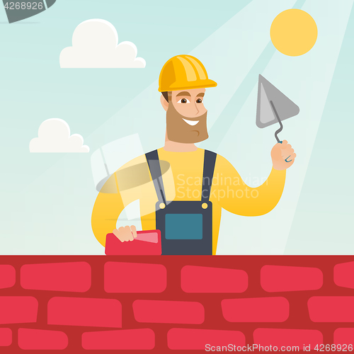 Image of Bricklayer working with spatula and brick.