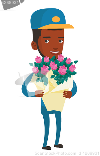 Image of Delivery courier holding bouquet of flowers.