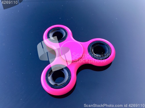 Image of purple fidget spinner stress relieving toy