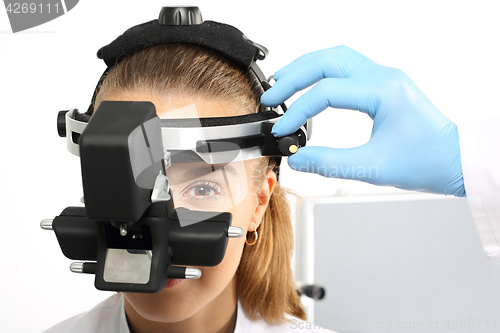 Image of An eye exam at an ophthalmologist, ophthalmoscope