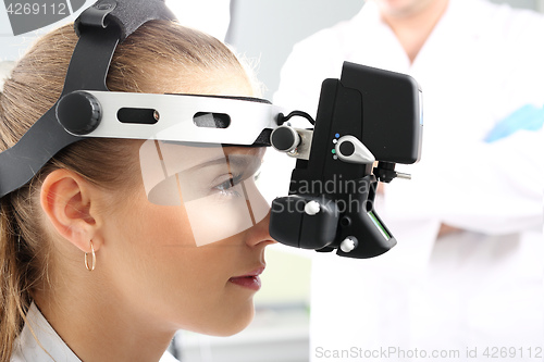 Image of An eye exam at an ophthalmologist, ophthalmoscope