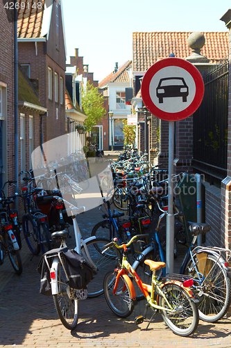 Image of Holland city street no cars road sign: pedal cycles only bikes parking