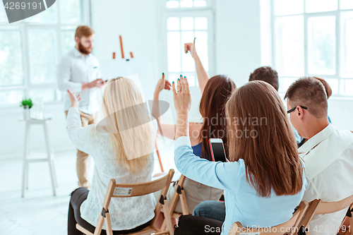 Image of Speaker at Business Meeting in the conference hall.