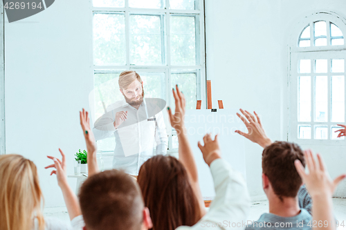 Image of Speaker at Business Meeting in the conference hall.