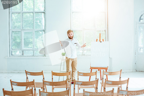 Image of Speaker at Business Meeting in the empty conference hall.