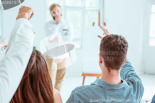 Image of Speaker at Business Meeting in the conference hall.