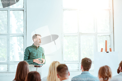 Image of Speaker at Business Meeting in the conference hall.