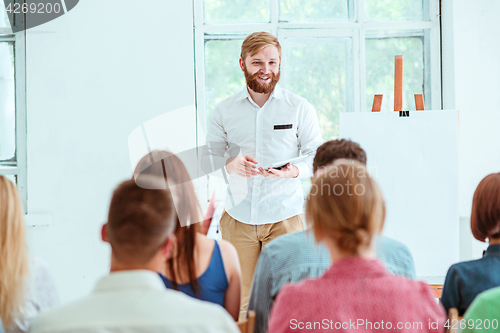 Image of Speaker at Business Meeting in the conference hall.