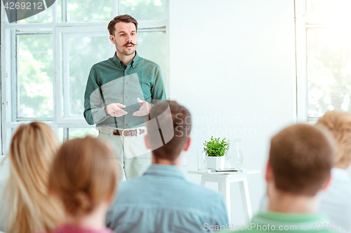 Image of Speaker at Business Meeting in the conference hall.