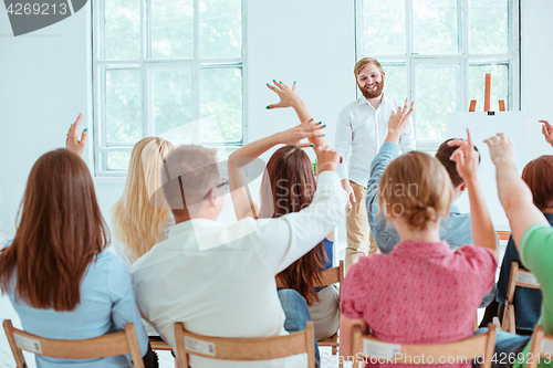 Image of Speaker at Business Meeting in the conference hall.