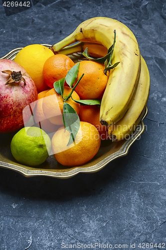 Image of Dish with tropical fruits and citrus