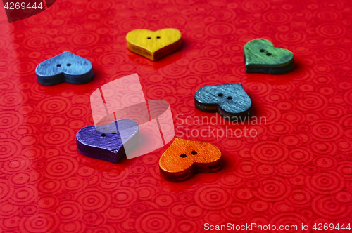 Image of Symbolic hearts on red background