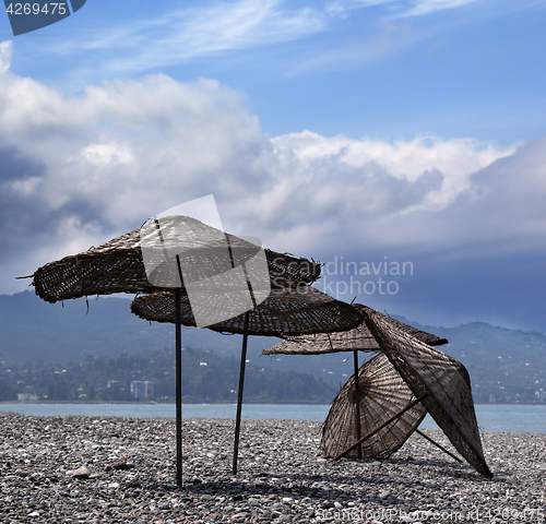 Image of Old sunshade on deserted beach