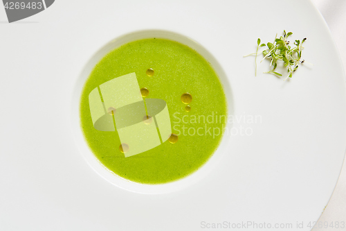 Image of cream soup puree of green peas view from the top