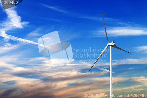 Image of Wind turbine and multicolor sunrise sky