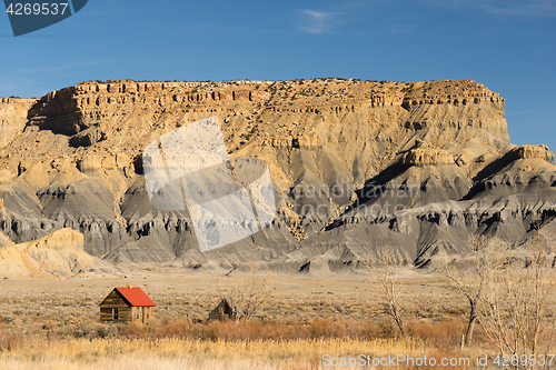 Image of Red Roofed Cabin Utah Wilderness Badlands