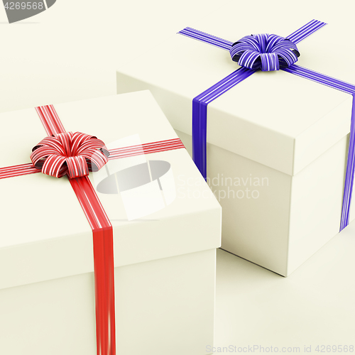 Image of Gift Boxes With Blue And Red Ribbons As Presents For Him And Her