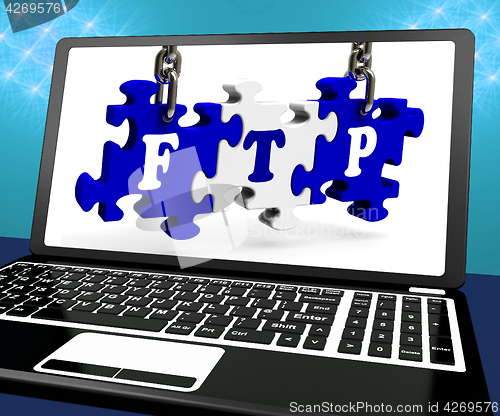Image of FTP Puzzle On Laptop Shows Files Transmission