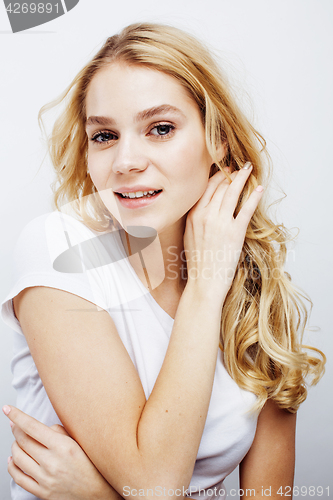 Image of young pretty blond teenage girl emotional posing, happy smiling isolated on white background, lifestyle people concept