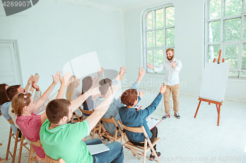 Image of Speaker at Business Meeting in the conference hall.