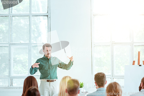 Image of Speaker at Business Meeting in the conference hall.