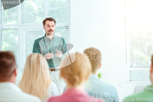 Image of Speaker at Business Meeting in the conference hall.