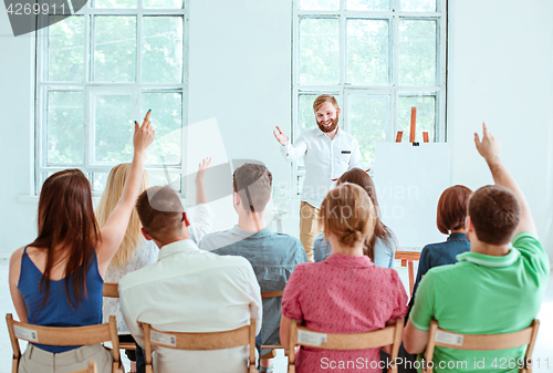 Image of Speaker at Business Meeting in the conference hall.