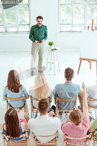 Image of Speaker at Business Meeting in the conference hall.