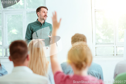 Image of Speaker at Business Meeting in the conference hall.