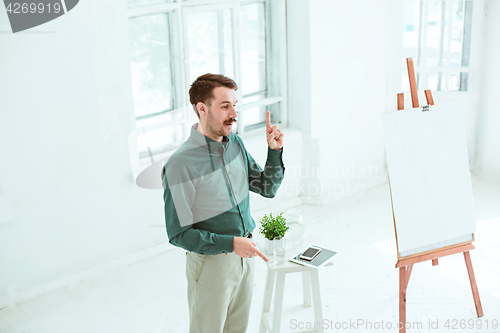 Image of Speaker at Business Meeting in the conference hall.