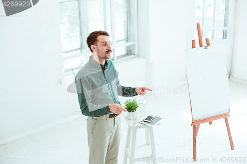 Image of Speaker at Business Meeting in the conference hall.