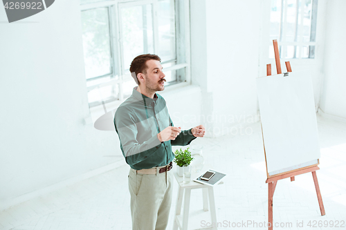 Image of Speaker at Business Meeting in the conference hall.