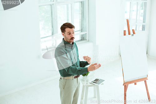 Image of Speaker at Business Meeting in the conference hall.