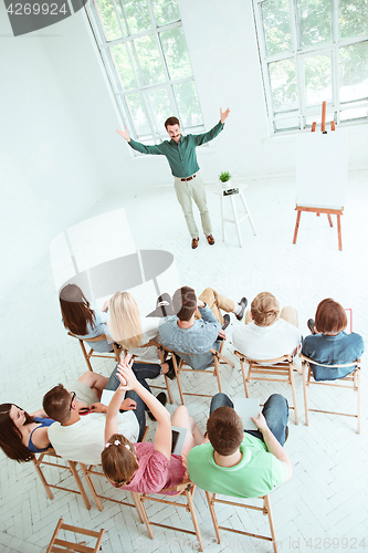 Image of Speaker at Business Meeting in the conference hall.