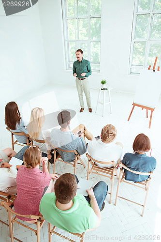 Image of Speaker at Business Meeting in the conference hall.