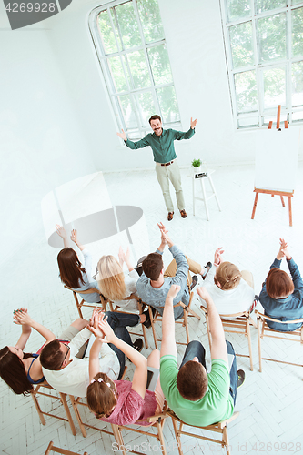 Image of Speaker at Business Meeting in the conference hall.