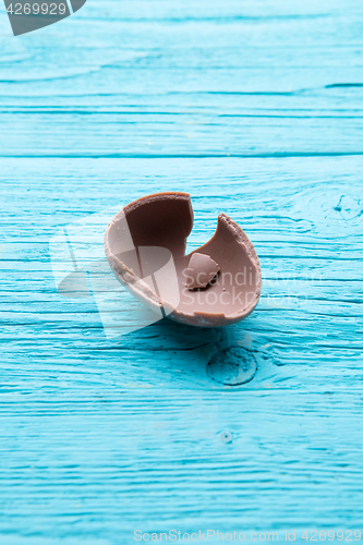 Image of Half chocolate egg, blue table