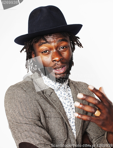 Image of young handsome afro american boy in stylish hipster hat gesturin