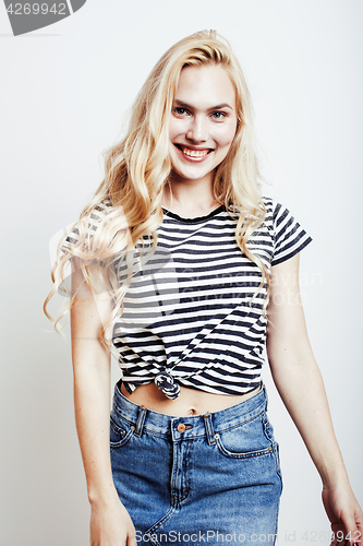 Image of young pretty stylish blond hipster girl posing emotional isolated on white background happy smiling cool smile, lifestyle people concept