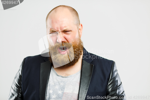 Image of Dissatisfied brutal man with beard