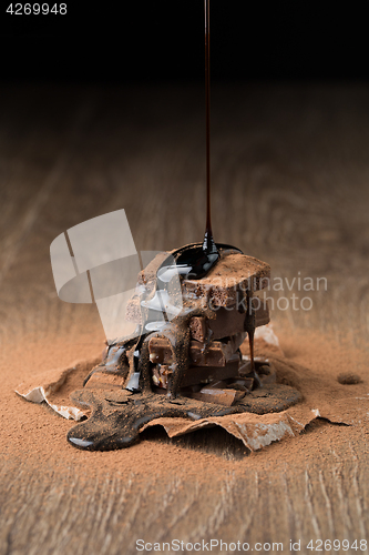 Image of Chocolate pyramid on wooden table