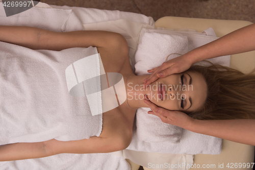 Image of woman receiving a head massage